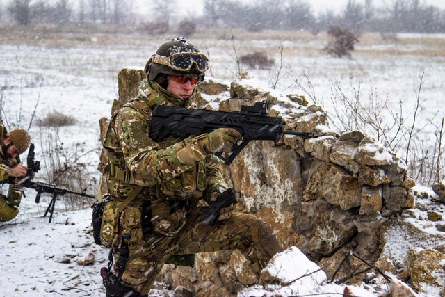 A Ukrainian soldier reloads his RPC Fort 221 rifle